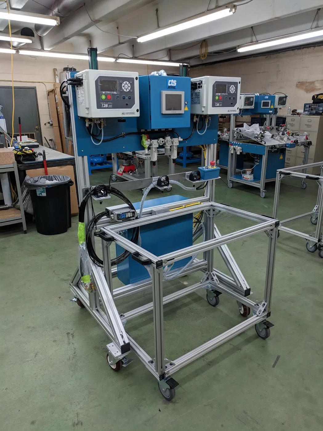 Twin-station pressure decay leak test stand with instrument enclosure